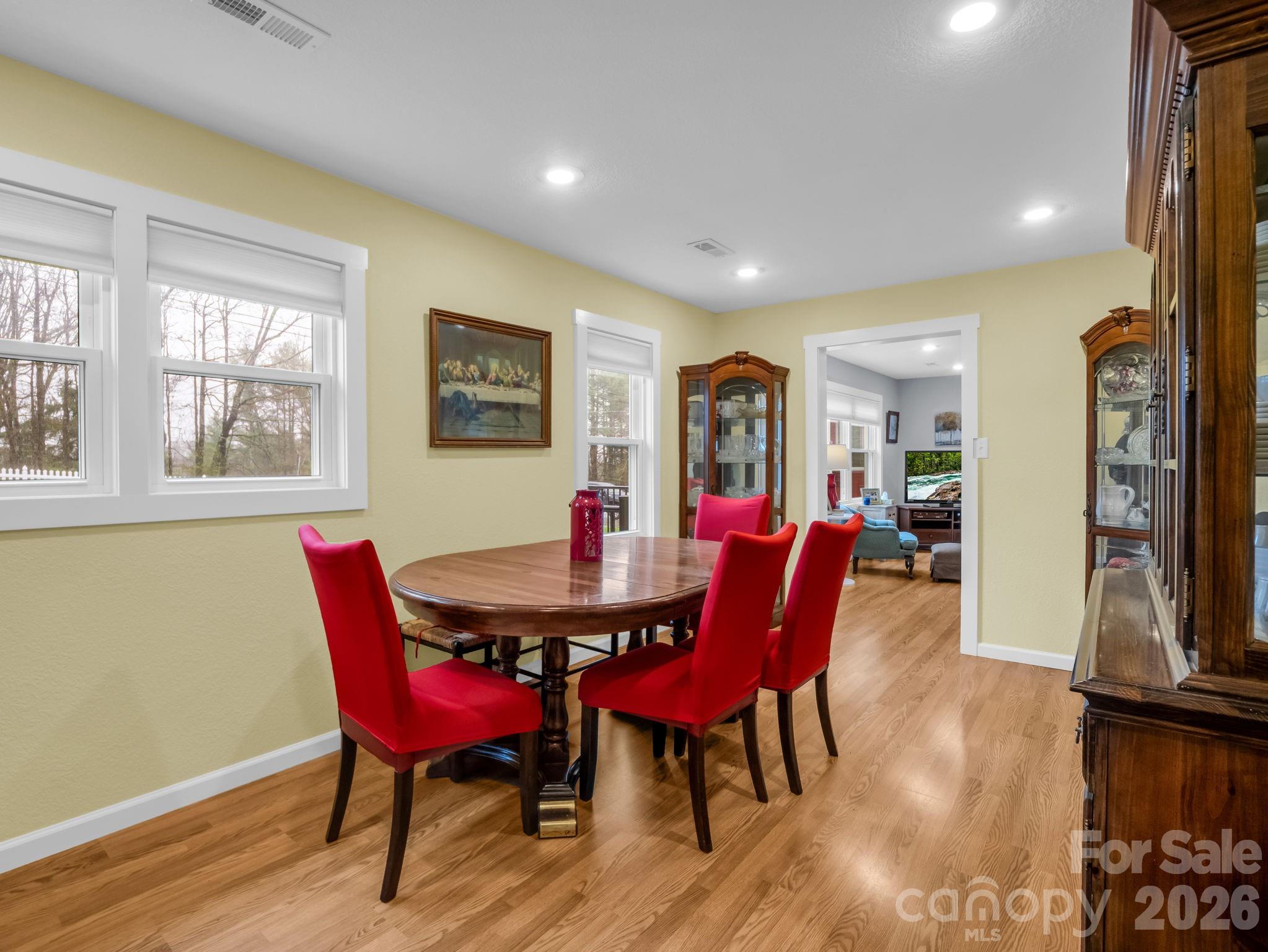 1086 Carters Ridge Road Spruce Pine, NC 28777 - Photo 6 of 48 a view of a dining room with furniture window and wooden floor