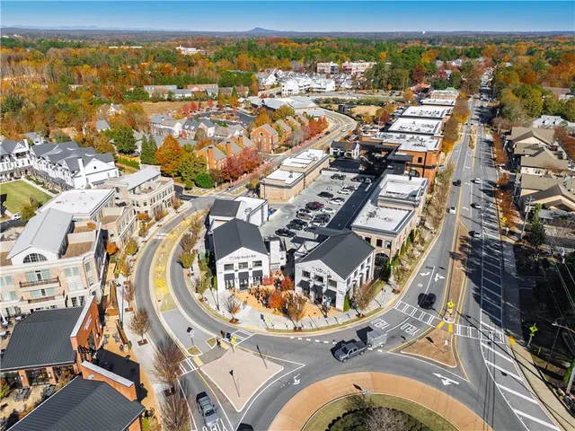 an aerial view of a swimming pool an ocean view