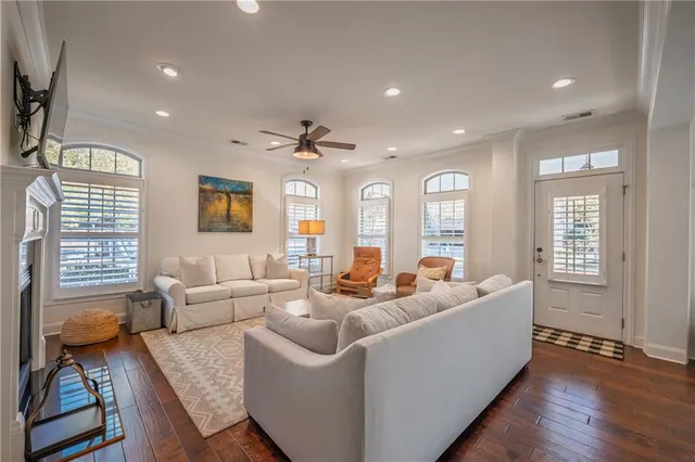 a living room with furniture window and wooden floor