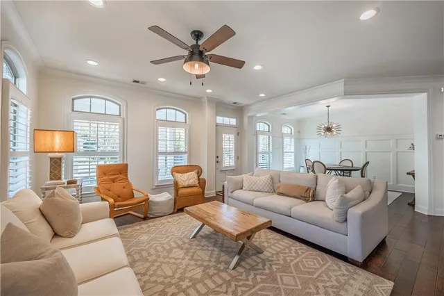 a living room with furniture and a large mirror