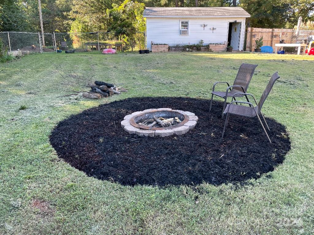1329 Peach Orchard Road Union, SC 29379 - Photo 15 of 15 a view of a backyard with table and chairs