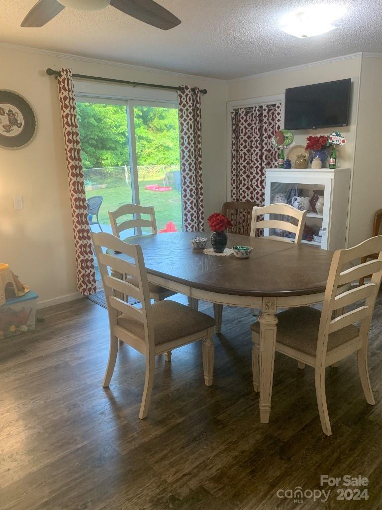 1329 Peach Orchard Road Union, SC 29379 - Photo 7 of 15 a view of a dining room with furniture window and wooden floor