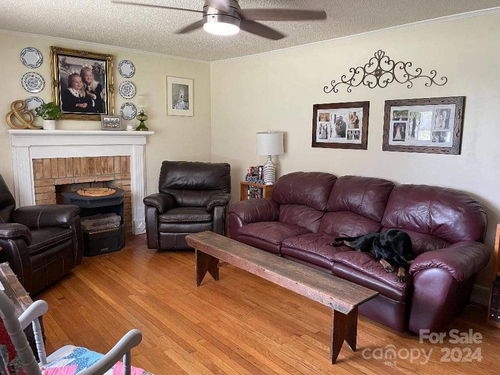 1329 Peach Orchard Road Union, SC 29379 - Photo 10 of 15 a living room with furniture or couch and a fireplace