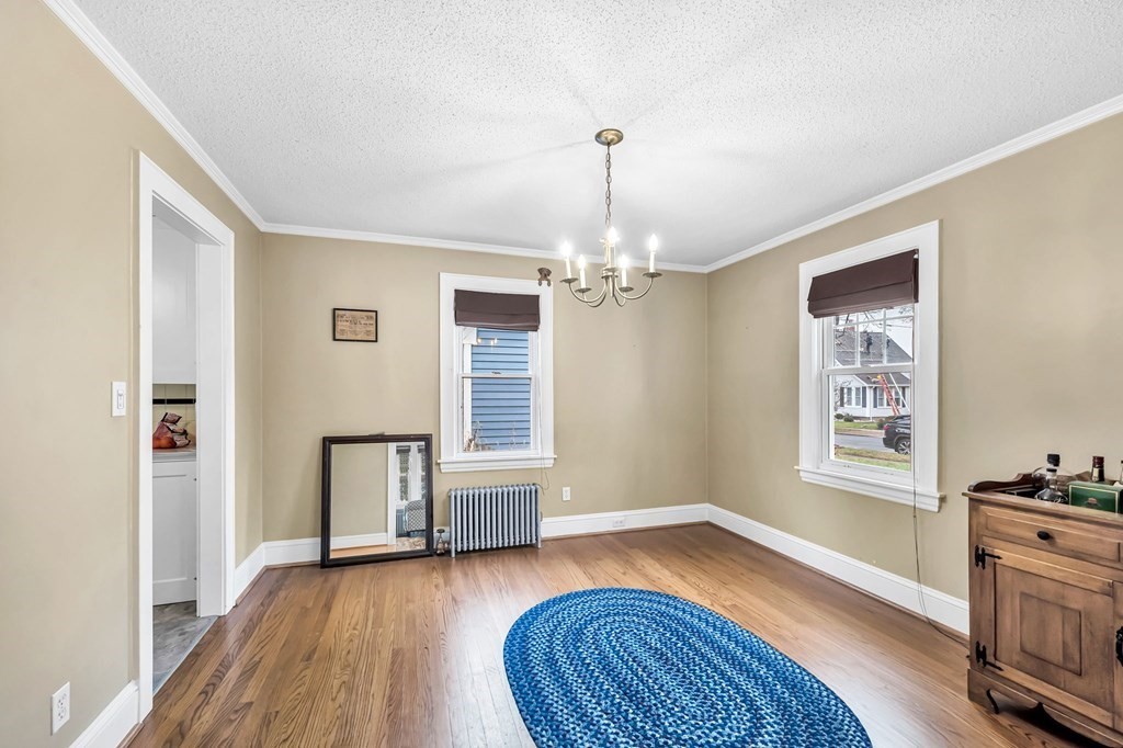 4 Ashbrook Street Springfield, MA 01118 - Photo 7 of 22 a view of livingroom with hardwood floor and kitchen view