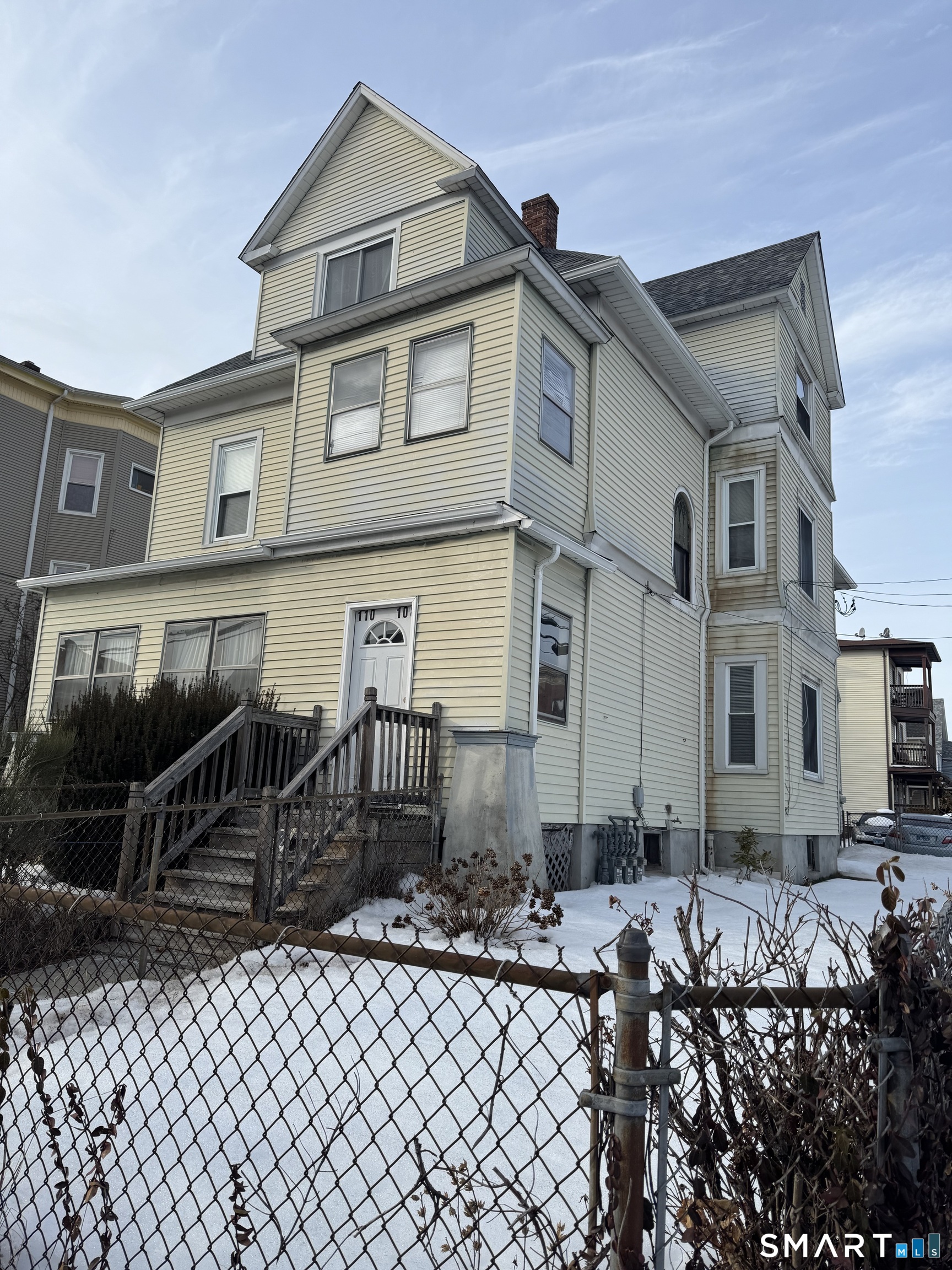 110 Adelaide Street Hartford, CT 06114 - Photo 1 of 14 a front view of a house with parking space