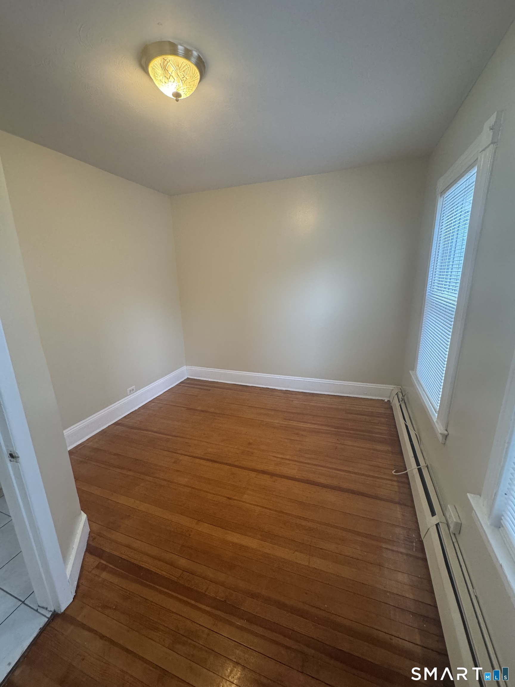 110 Adelaide Street Hartford, CT 06114 - Photo 11 of 14 a view of empty room with wooden floor