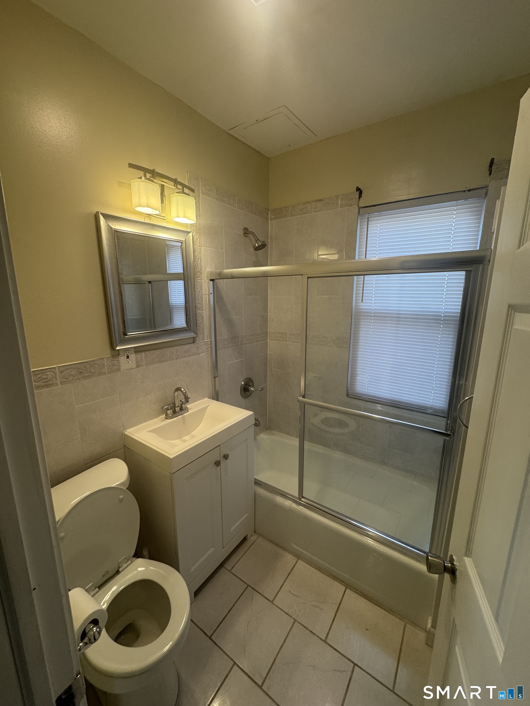 110 Adelaide Street Hartford, CT 06114 - Photo 12 of 14 a bathroom with a toilet sink and shower