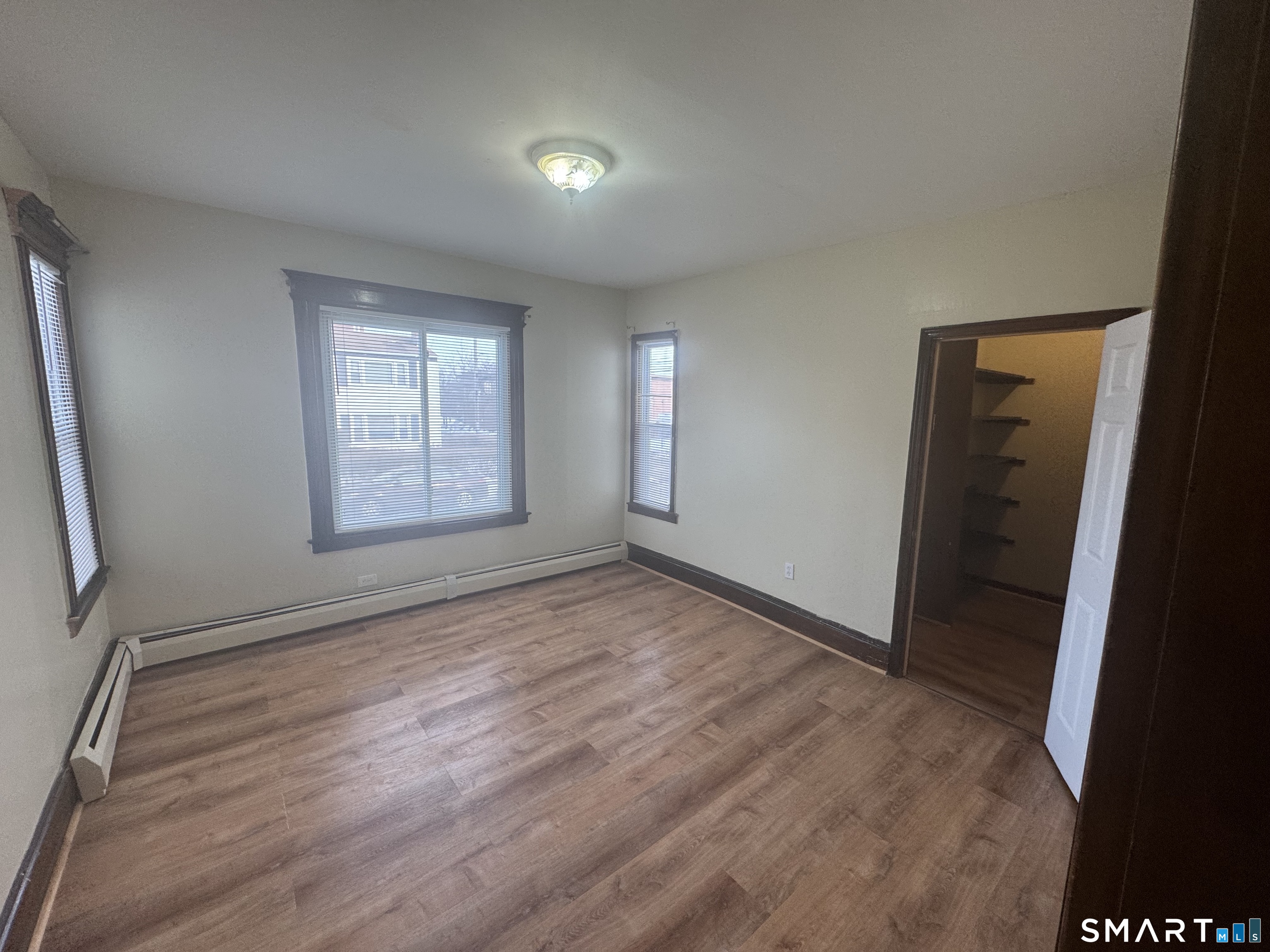 110 Adelaide Street Hartford, CT 06114 - Photo 6 of 14 an empty room with windows
