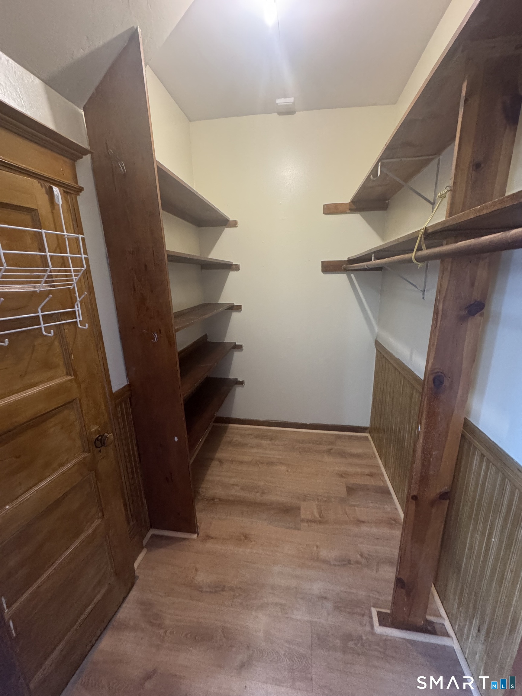 110 Adelaide Street Hartford, CT 06114 - Photo 7 of 14 a view of walk in closet with empty racks