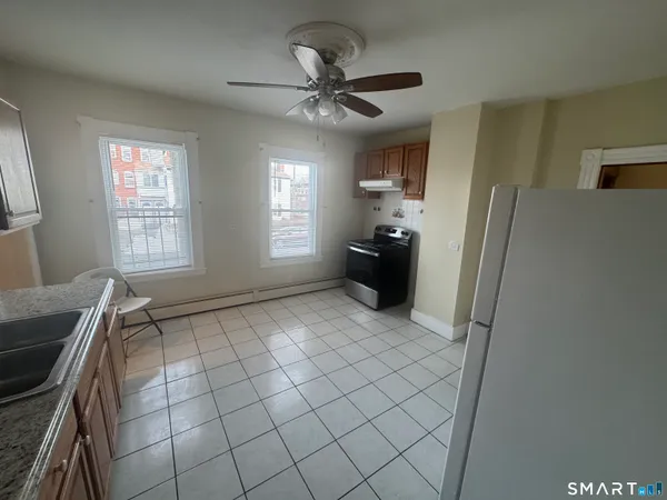 a view of an empty room with a window
