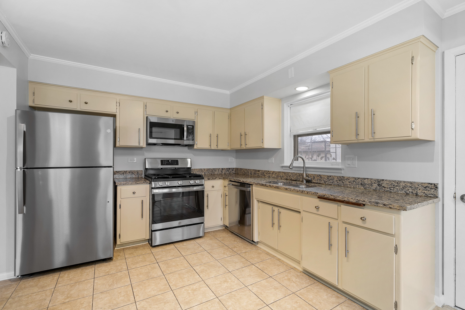204 Dulles Road Des Plaines, IL 60016 - Photo 11 of 25 a kitchen with stainless steel appliances granite countertop a refrigerator sink and stove