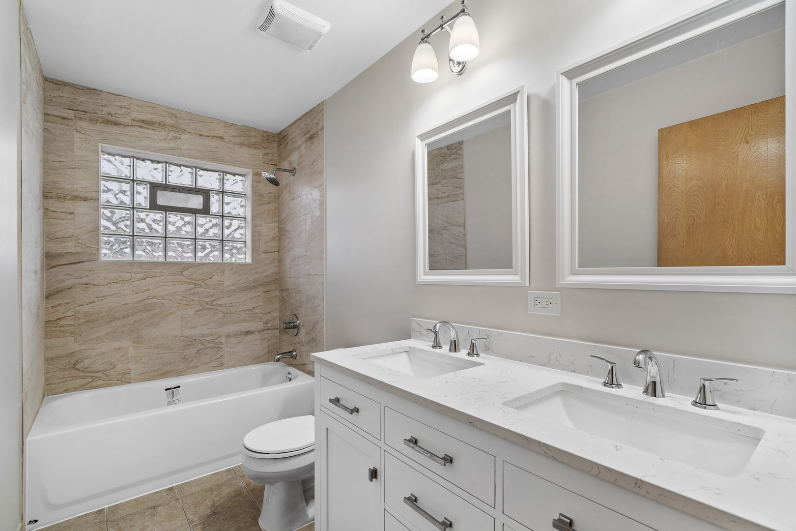 204 Dulles Road Des Plaines, IL 60016 - Photo 16 of 25 a bathroom with a sink a toilet a shower a mirror and a bathtub