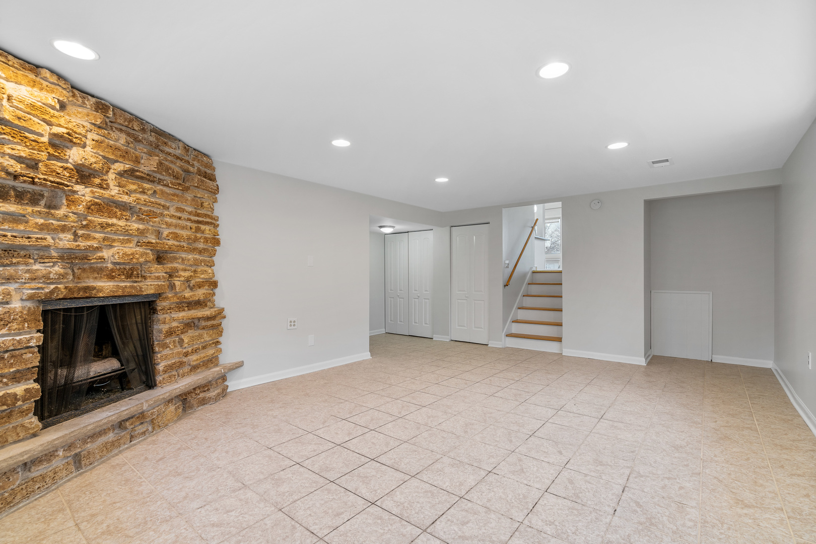 204 Dulles Road Des Plaines, IL 60016 - Photo 17 of 25 an empty room with windows and fireplace