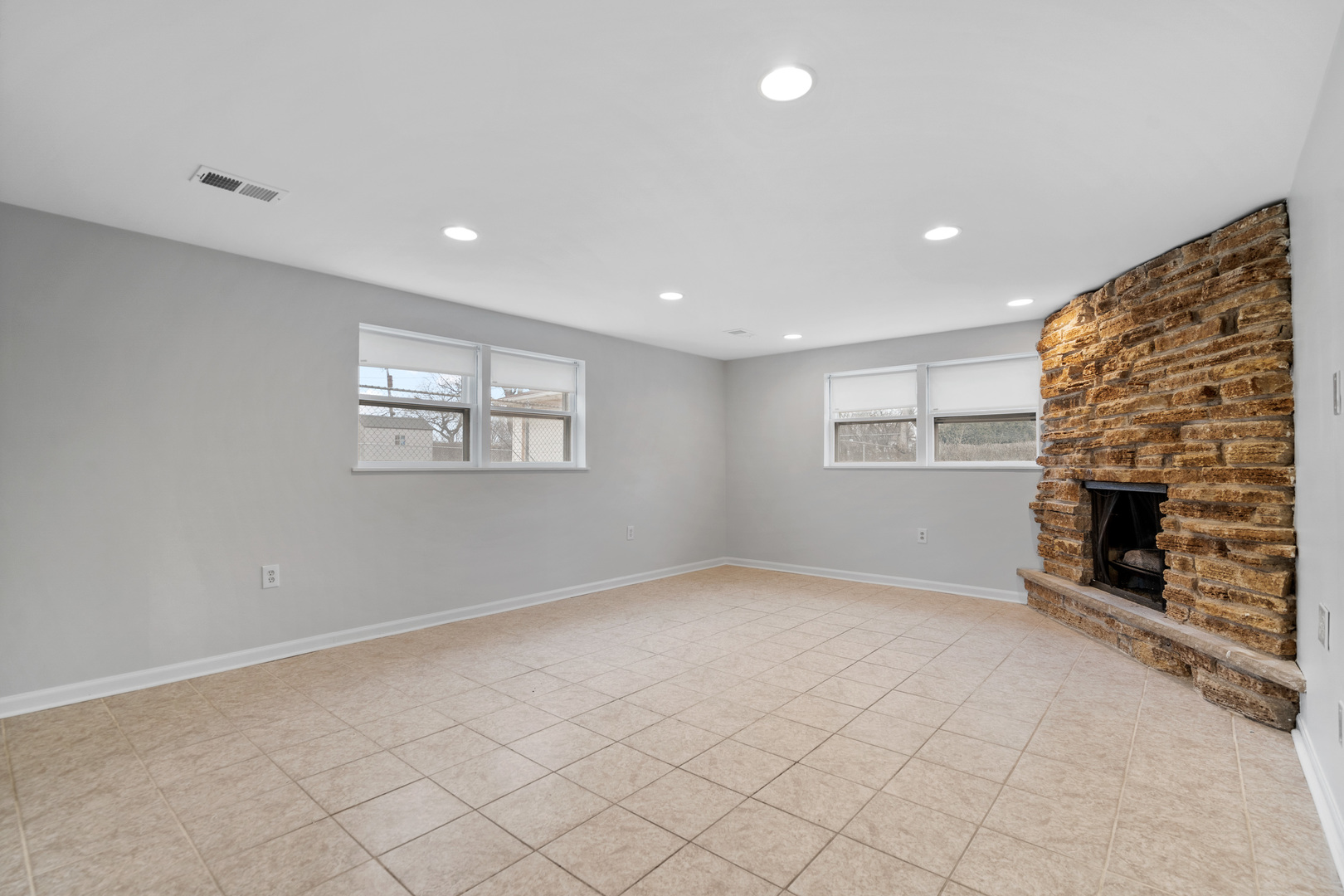 204 Dulles Road Des Plaines, IL 60016 - Photo 18 of 25 an empty room with windows and fireplace