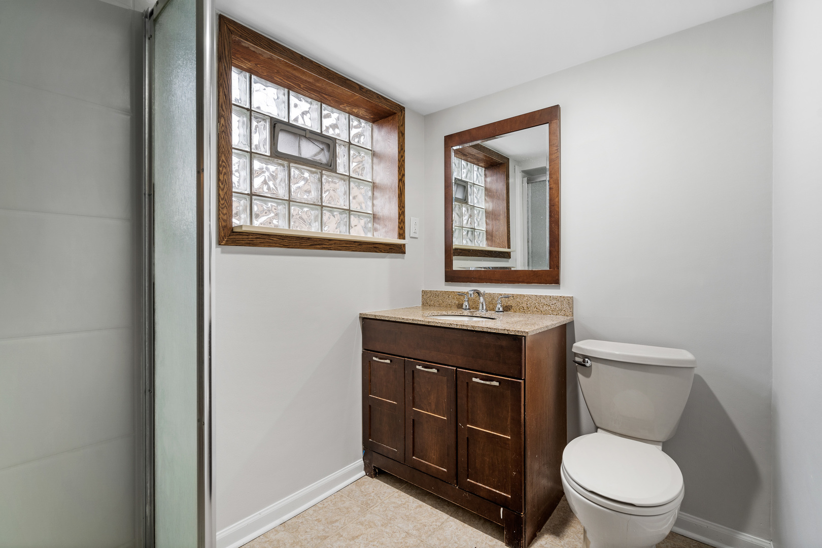 204 Dulles Road Des Plaines, IL 60016 - Photo 20 of 25 a bathroom with a toilet a sink and a window