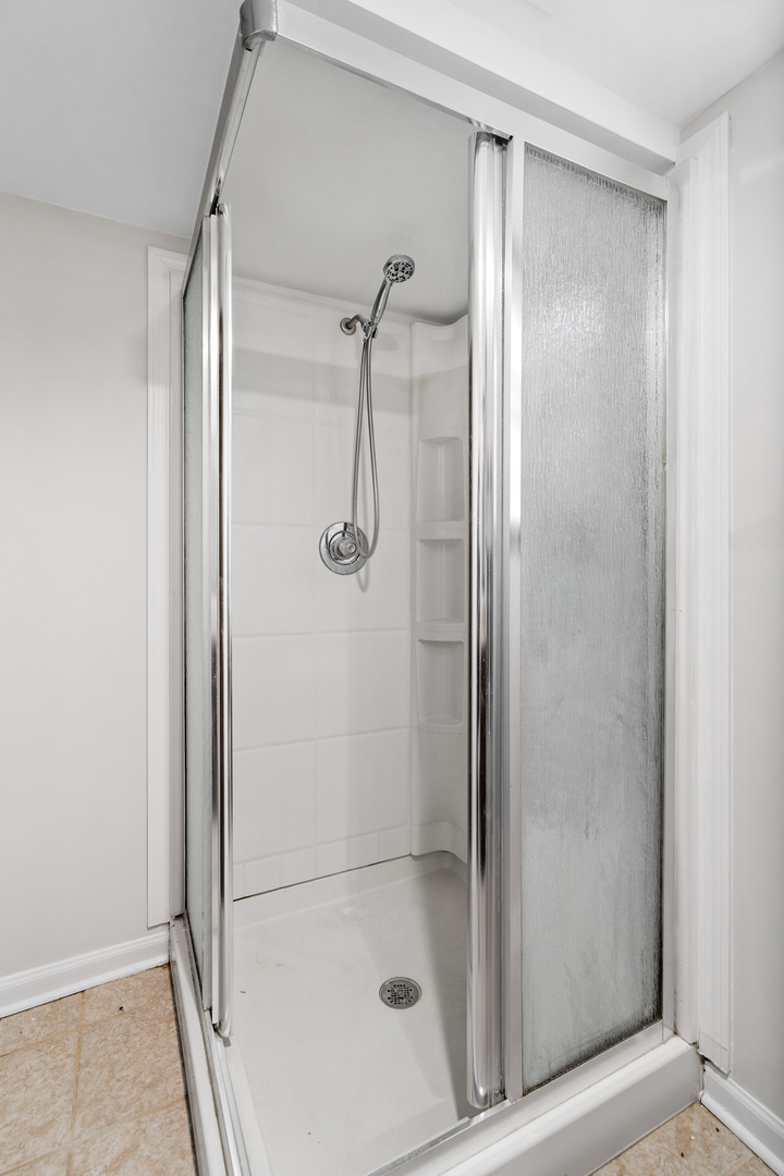 204 Dulles Road Des Plaines, IL 60016 - Photo 21 of 25 a bathroom with a glass shower door