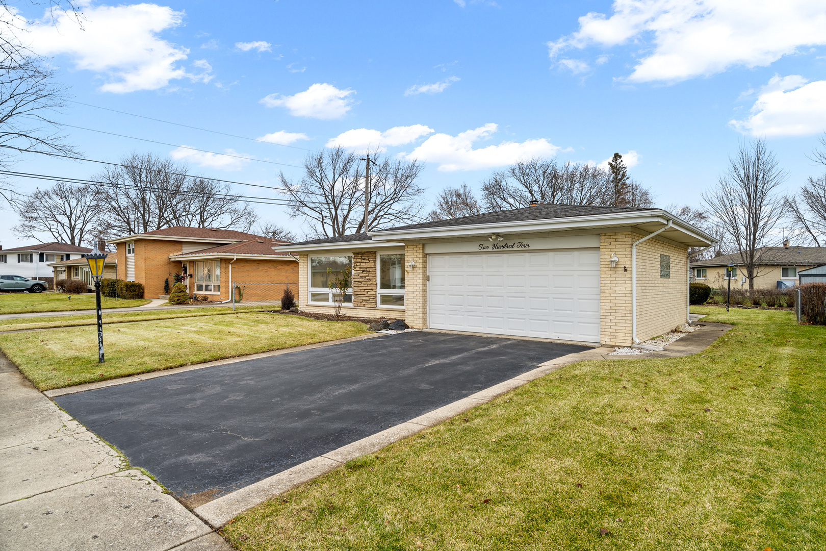 204 Dulles Road Des Plaines, IL 60016 - Photo 3 of 25 front view of a house with a big yard