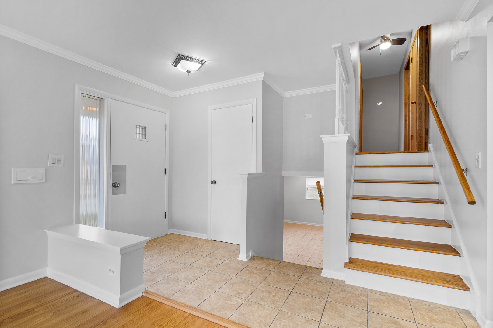 204 Dulles Road Des Plaines, IL 60016 - Photo 4 of 25 a view of a hallway with wooden floor and entryway
