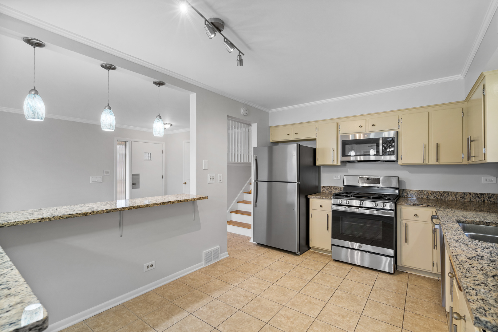 204 Dulles Road Des Plaines, IL 60016 - Photo 9 of 25 a kitchen with stainless steel appliances a stove a sink and a refrigerator