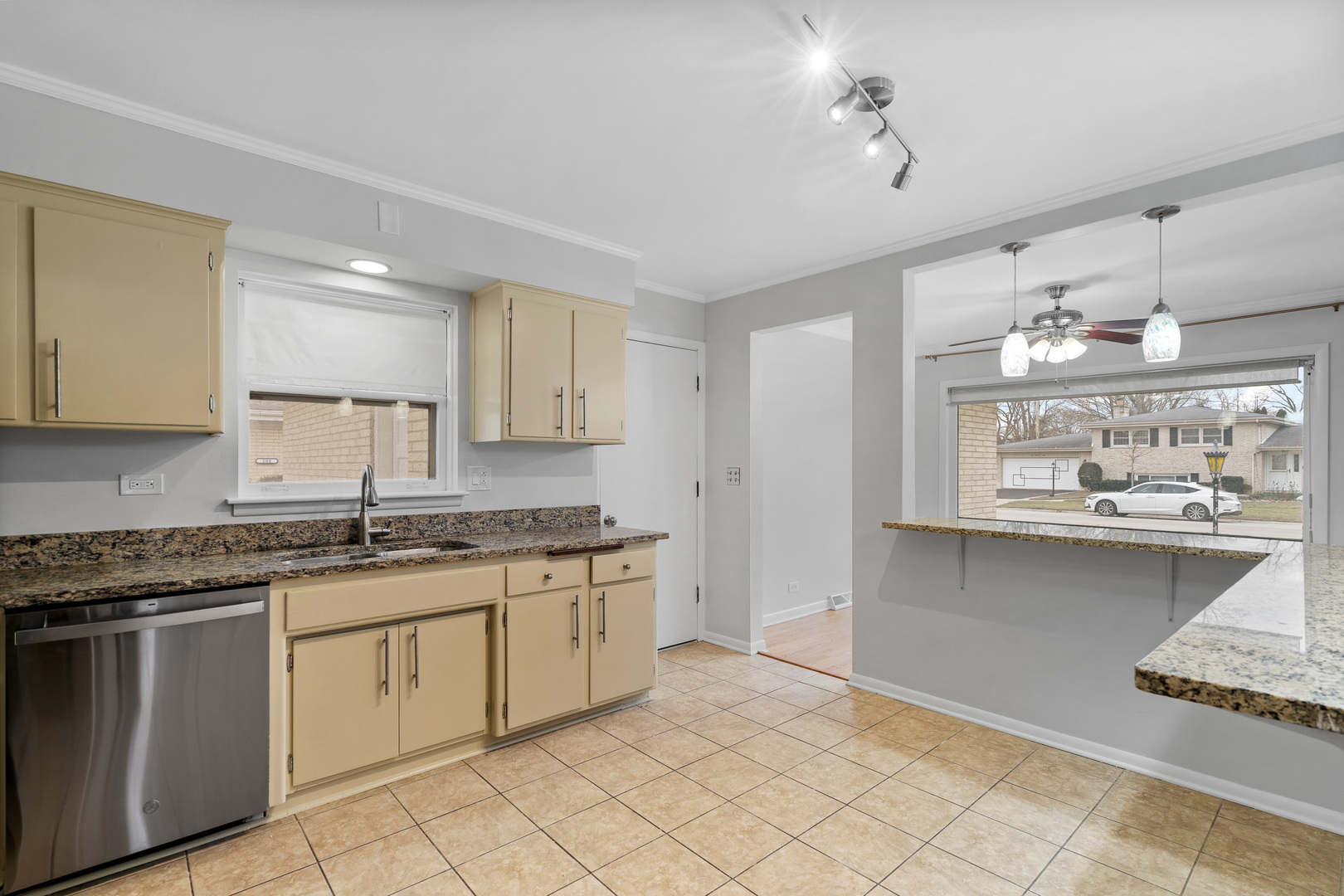 204 Dulles Road Des Plaines, IL 60016 - Photo 10 of 25 a kitchen with cabinets appliances and a counter top