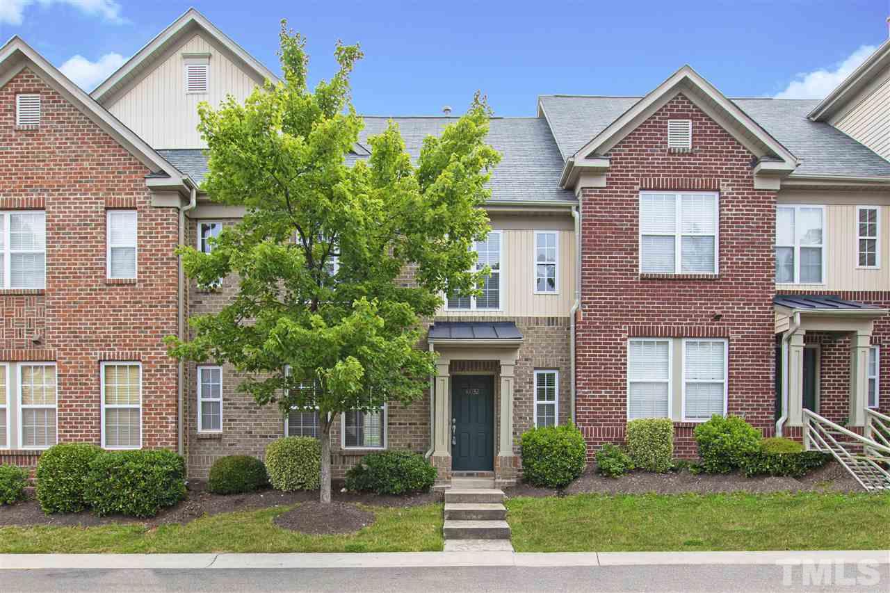 10032 Blackwell Drive Raleigh, NC 27617 - Photo 1 of 28 a front view of a house with garden