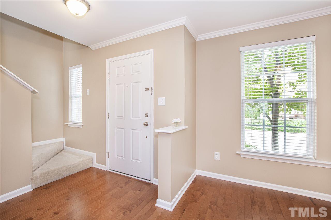 10032 Blackwell Drive Raleigh, NC 27617 - Photo 3 of 28 a view of an empty room with wooden floor and a window