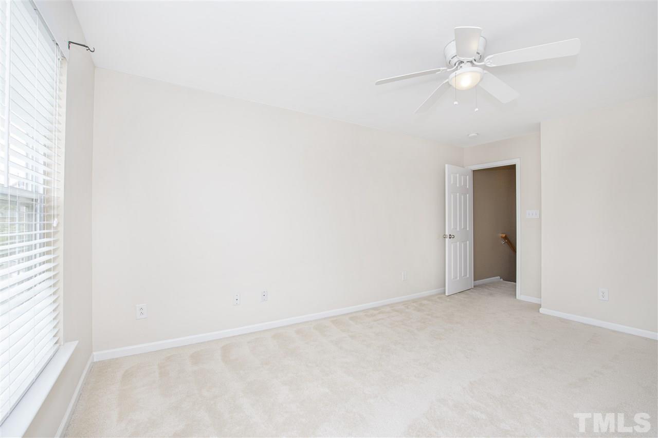 10032 Blackwell Drive Raleigh, NC 27617 - Photo 21 of 28 an empty room with a window and a fan
