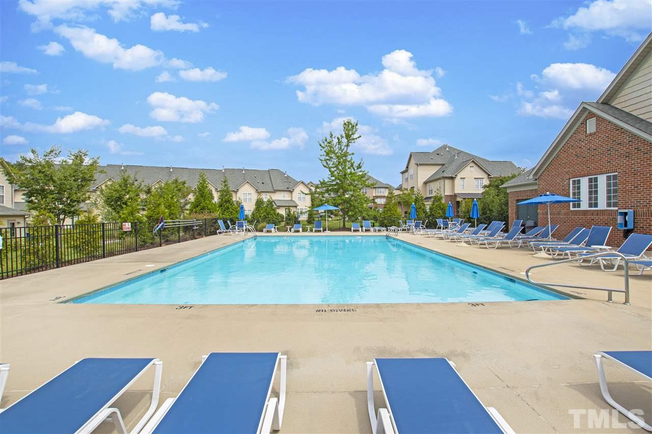 10032 Blackwell Drive Raleigh, NC 27617 - Photo 26 of 28 a view of a swimming pool with an outdoor seating