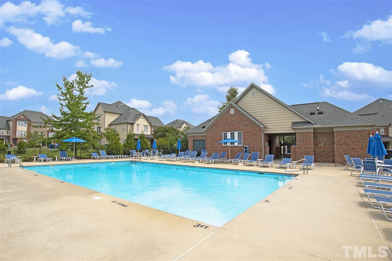 10032 Blackwell Drive Raleigh, NC 27617 - Photo 27 of 28 a view of a house with swimming pool and sitting area