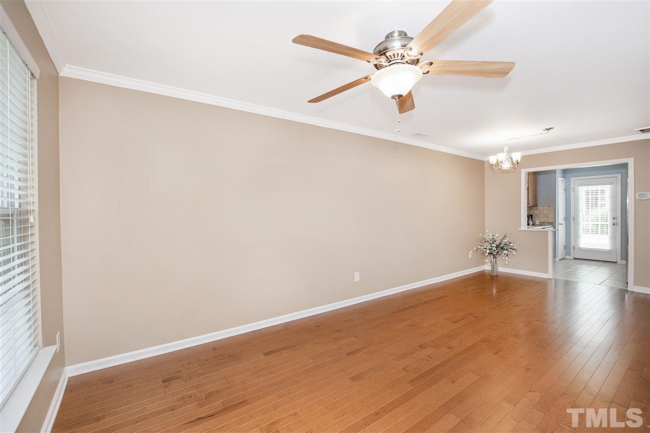 10032 Blackwell Drive Raleigh, NC 27617 - Photo 6 of 28 wooden floor in an empty room with a window