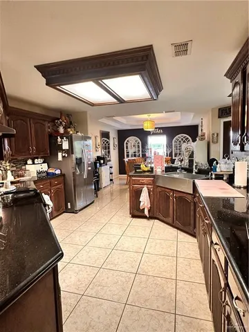 a bathroom with a sink a toilet a mirror and shower