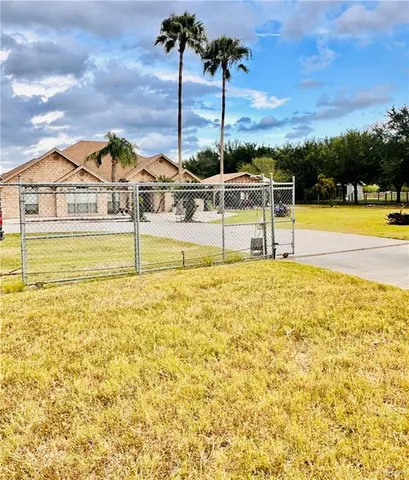 a view of an house with pool and ocean view
