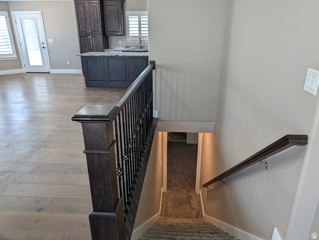 171 South Mustang Road East Grantsville, UT 84029 - Photo 18 of 41 Open-concept main living area with wood-finish flooring