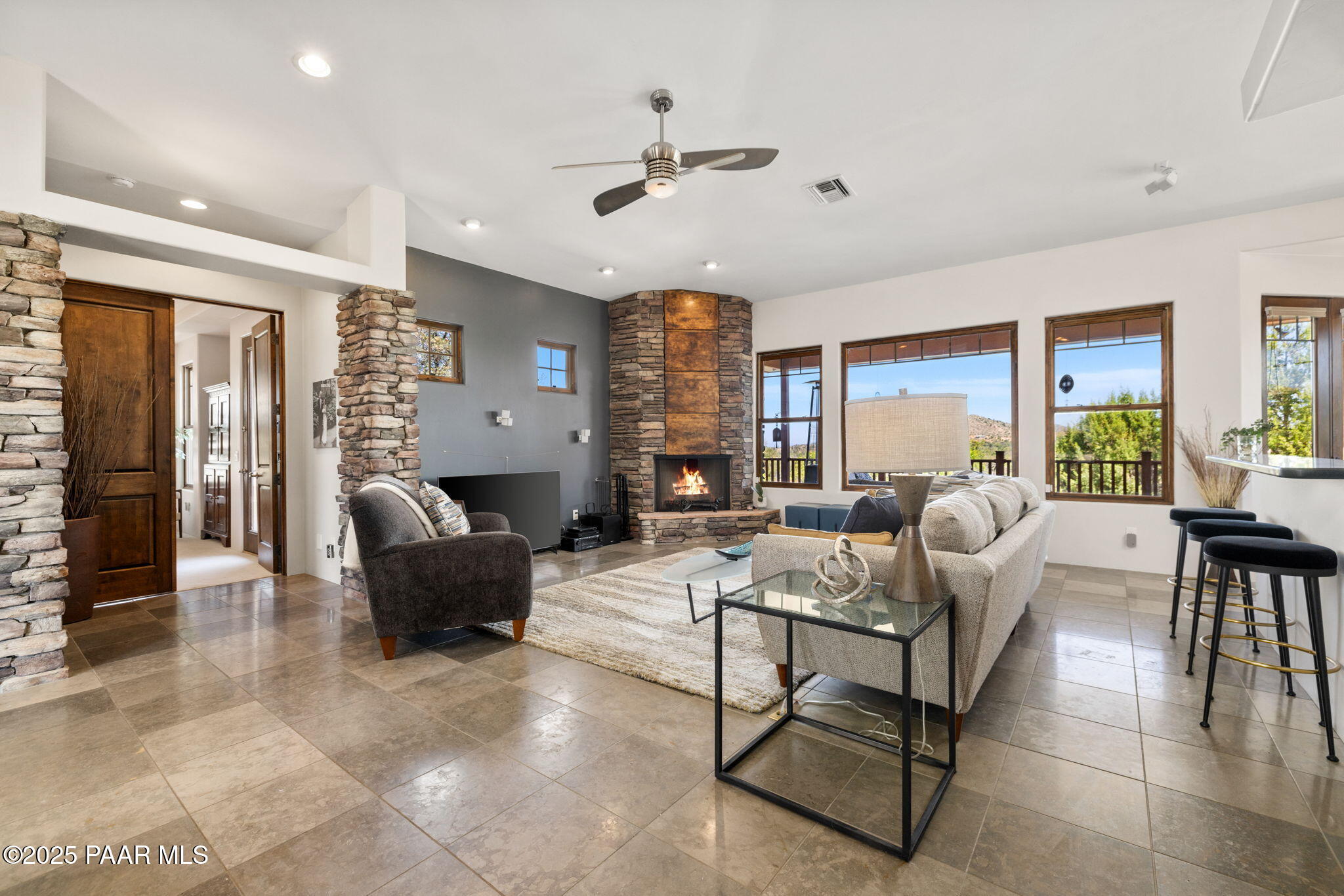 13175 North Bull Run Road Prescott, AZ 86305 - Photo 11 of 60 a living room with fireplace furniture and a large window