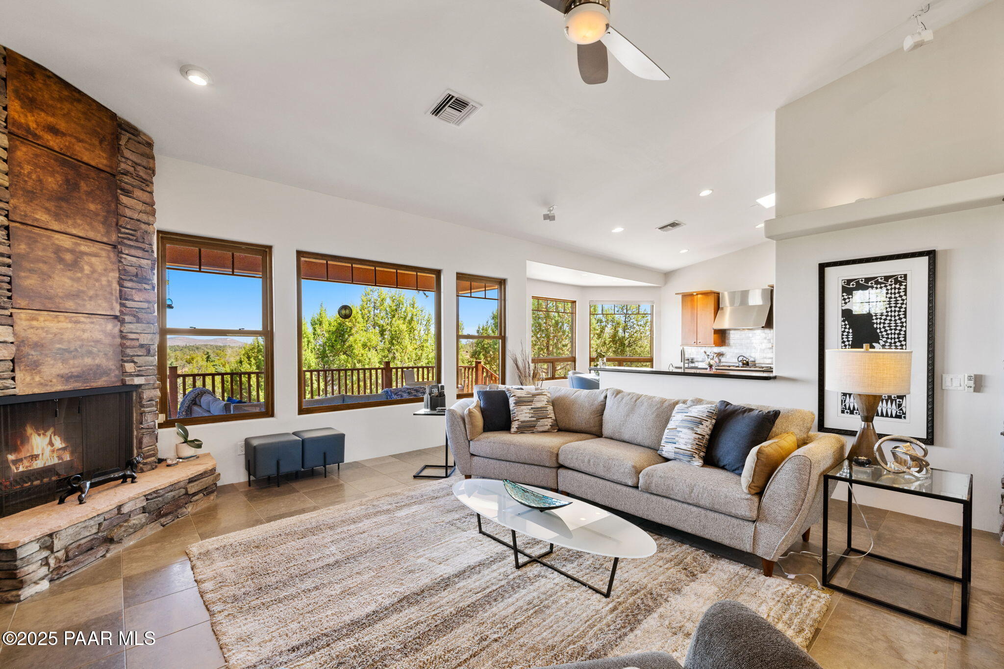13175 North Bull Run Road Prescott, AZ 86305 - Photo 12 of 60 a living room with furniture fireplace and a large window