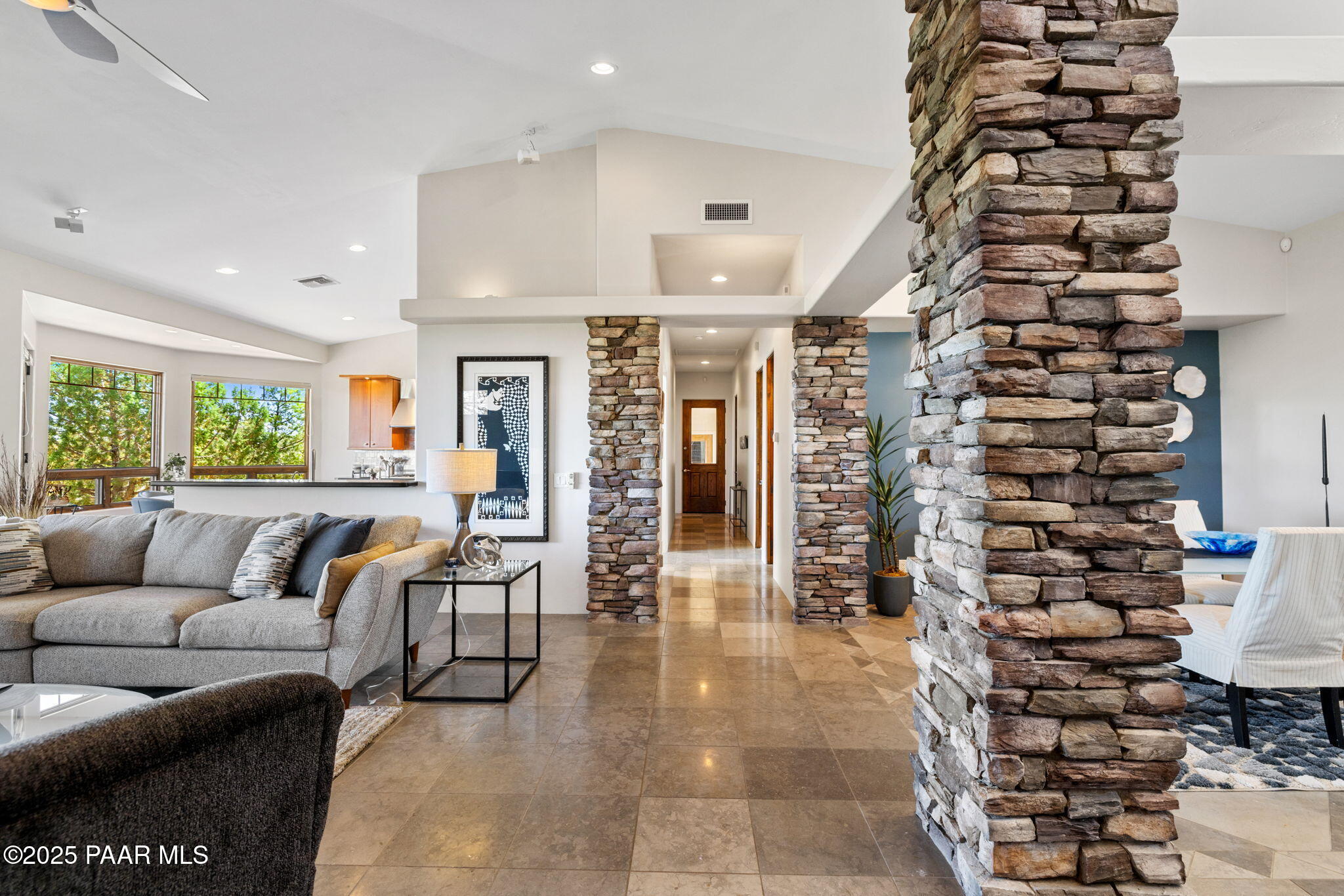 13175 North Bull Run Road Prescott, AZ 86305 - Photo 13 of 60 a living room with furniture and a potted plant