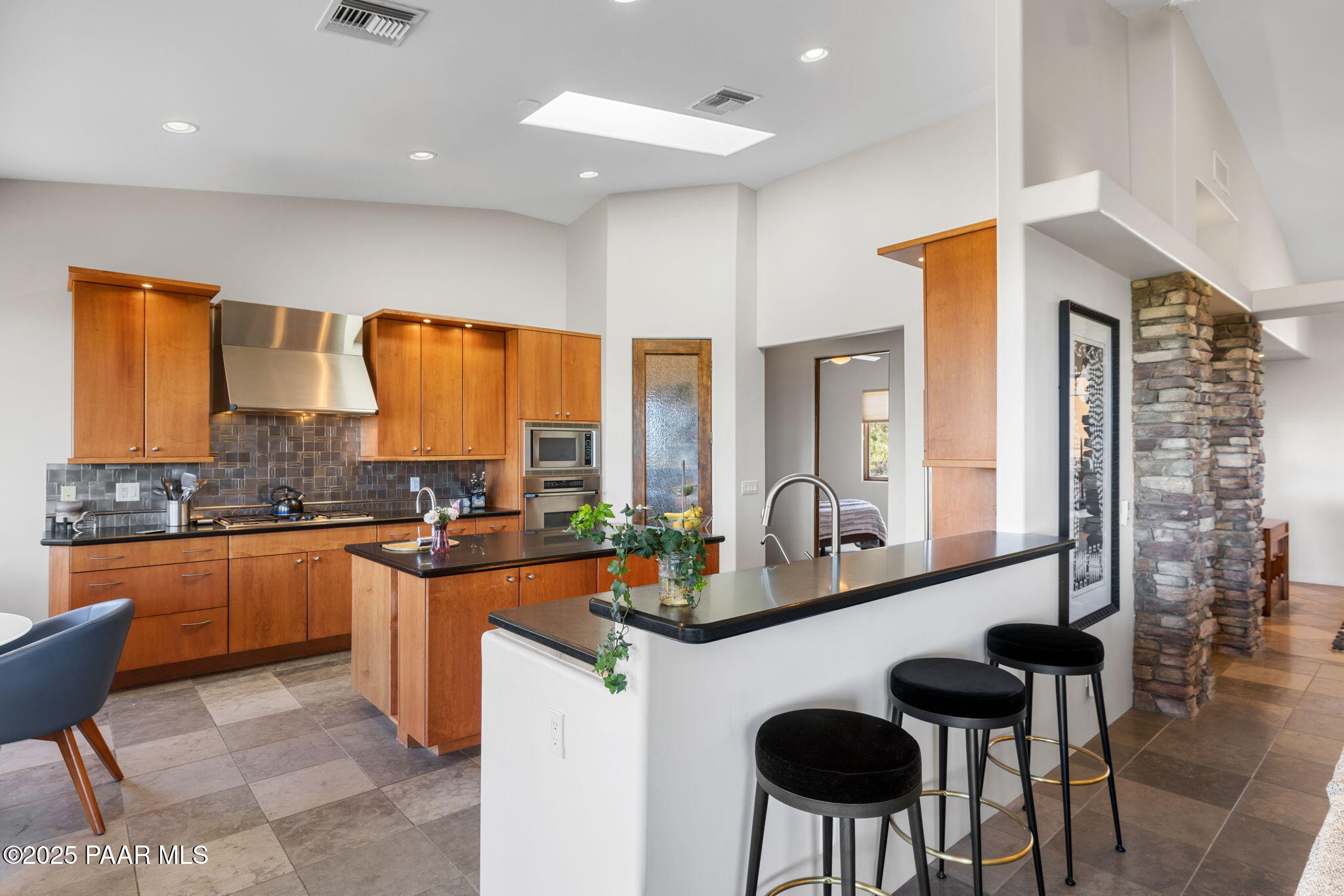 13175 North Bull Run Road Prescott, AZ 86305 - Photo 16 of 60 a large kitchen with lots of counter and chairs