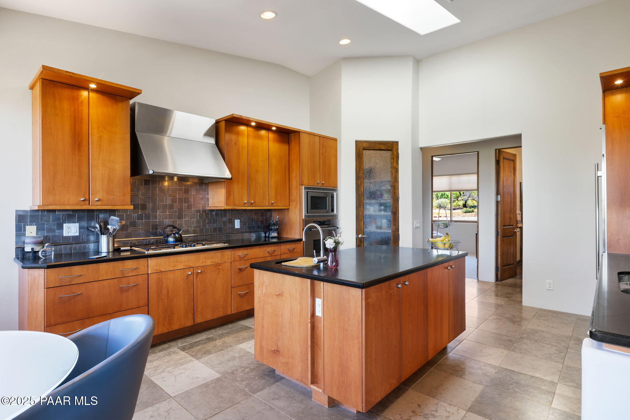 13175 North Bull Run Road Prescott, AZ 86305 - Photo 17 of 60 a kitchen with stainless steel appliances granite countertop a sink and a refrigerator