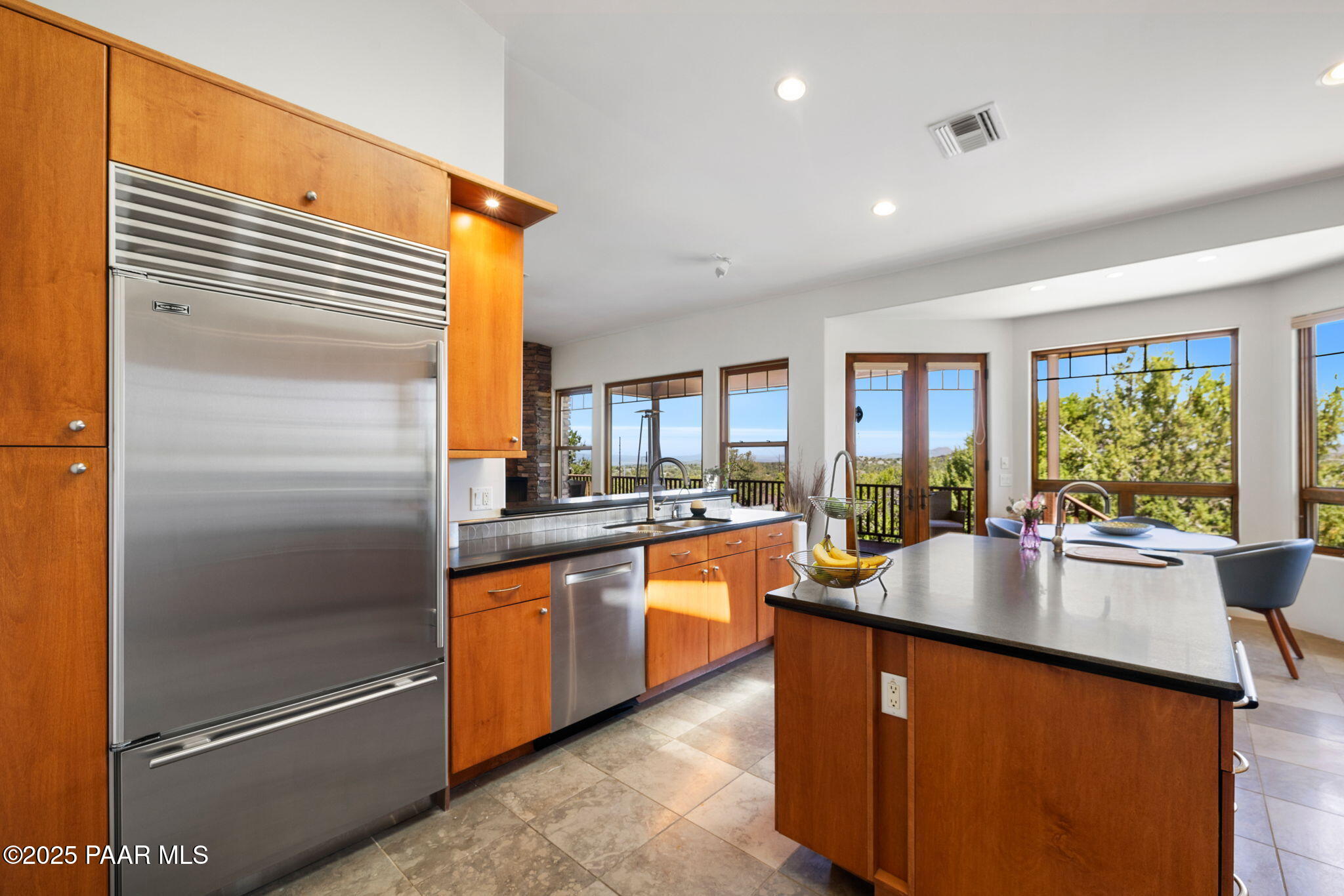 13175 North Bull Run Road Prescott, AZ 86305 - Photo 20 of 60 a kitchen with stainless steel appliances granite countertop a refrigerator a sink and a stove