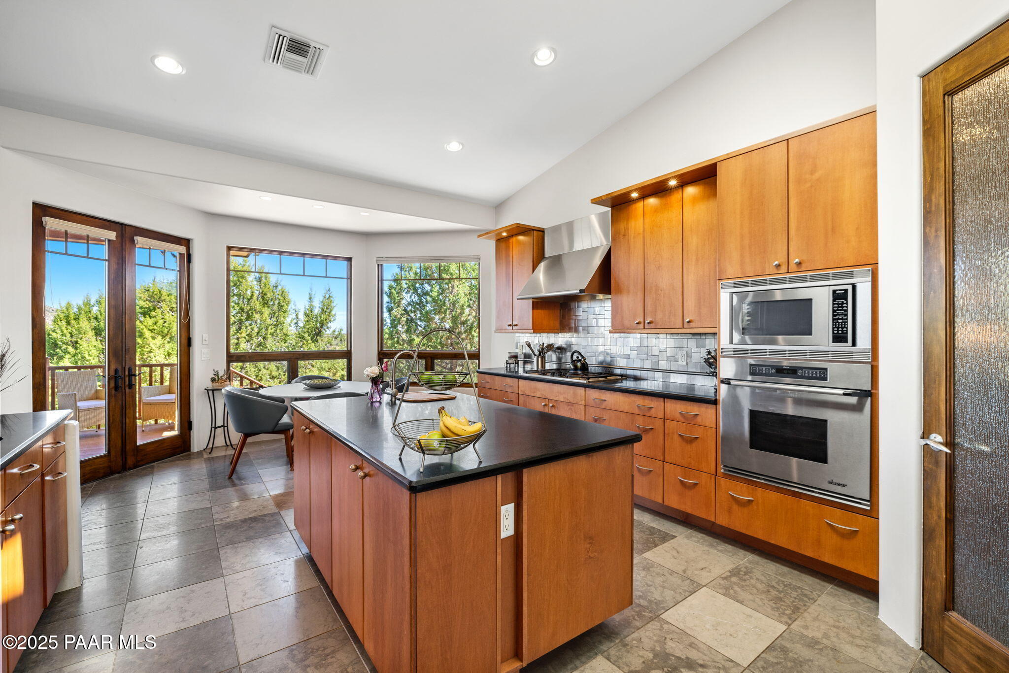 13175 North Bull Run Road Prescott, AZ 86305 - Photo 21 of 60 a kitchen with stainless steel appliances granite countertop sink stove and refrigerator