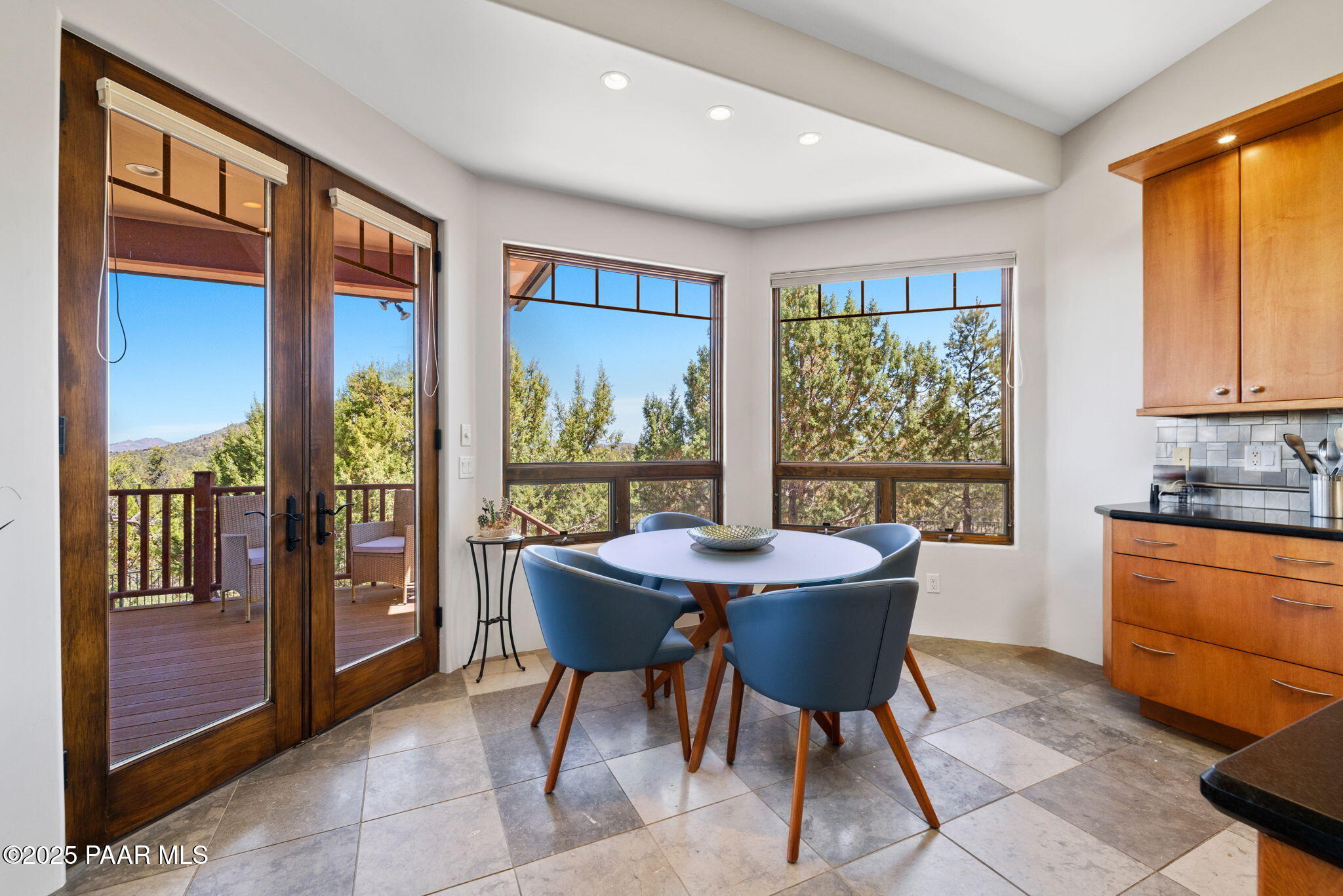 13175 North Bull Run Road Prescott, AZ 86305 - Photo 25 of 60 a dining room with furniture and large windows