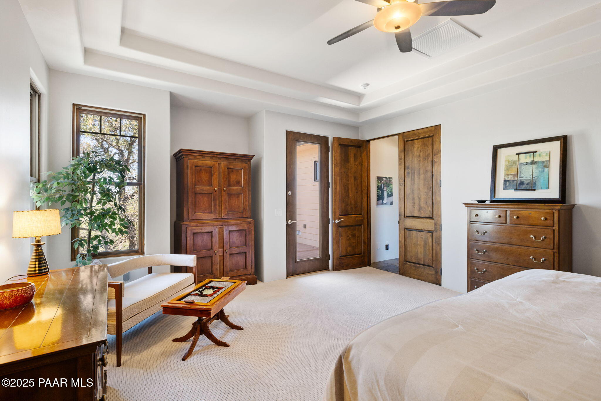 13175 North Bull Run Road Prescott, AZ 86305 - Photo 30 of 60 a bedroom with a bed dresser and a large mirror