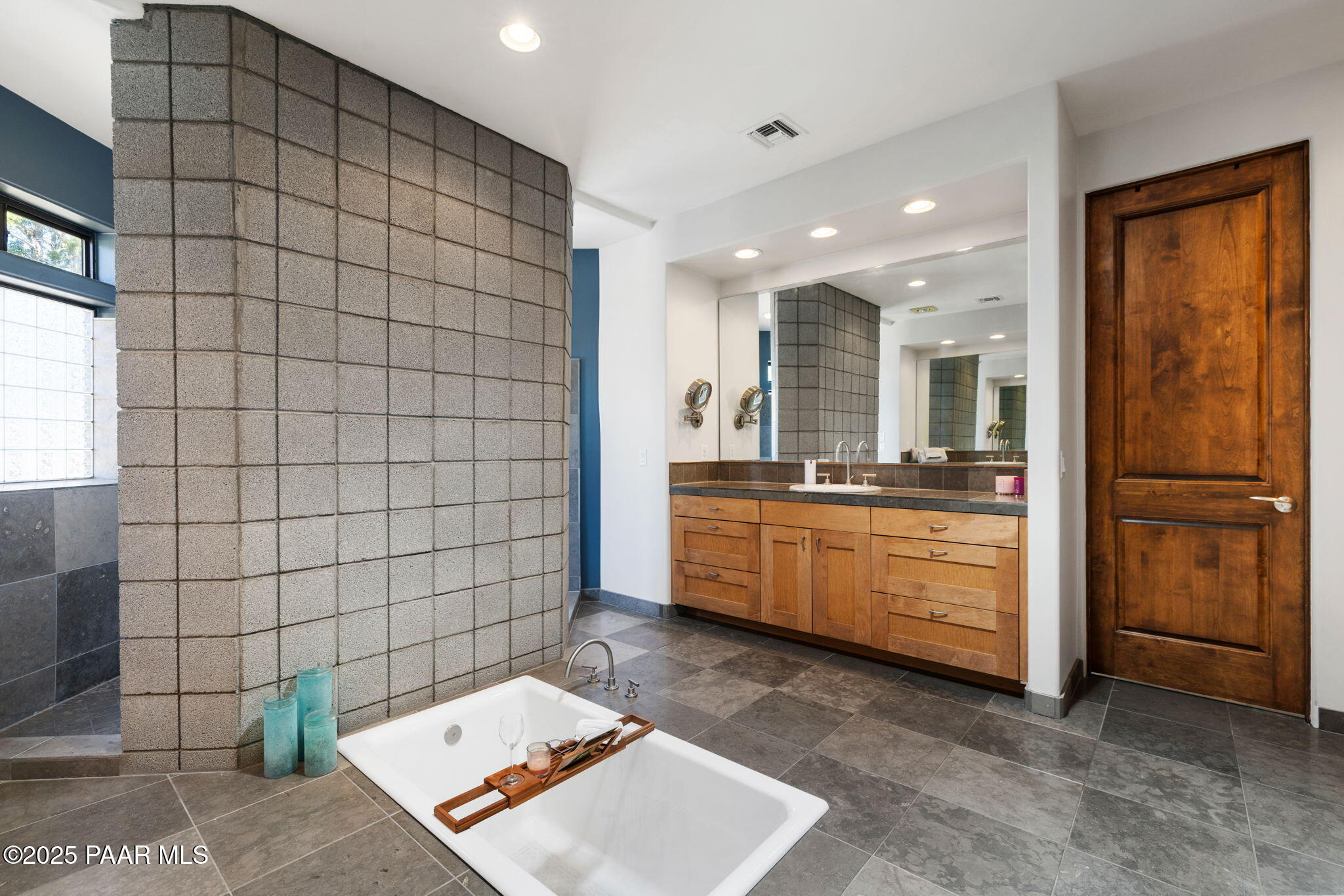 13175 North Bull Run Road Prescott, AZ 86305 - Photo 32 of 60 a bathroom with a sink a mirror and a shower