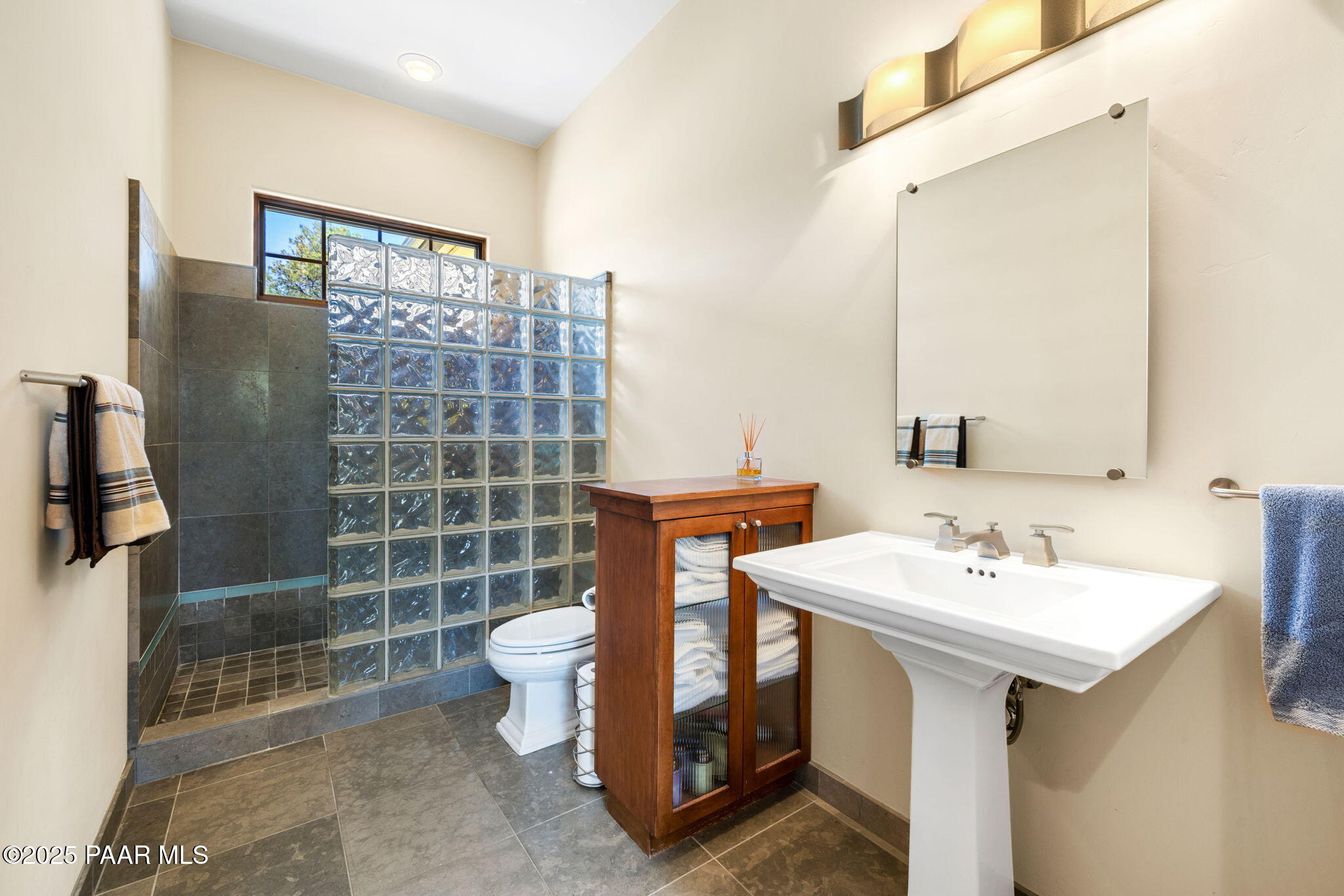 13175 North Bull Run Road Prescott, AZ 86305 - Photo 38 of 60 a bathroom with a sink toilet and shower