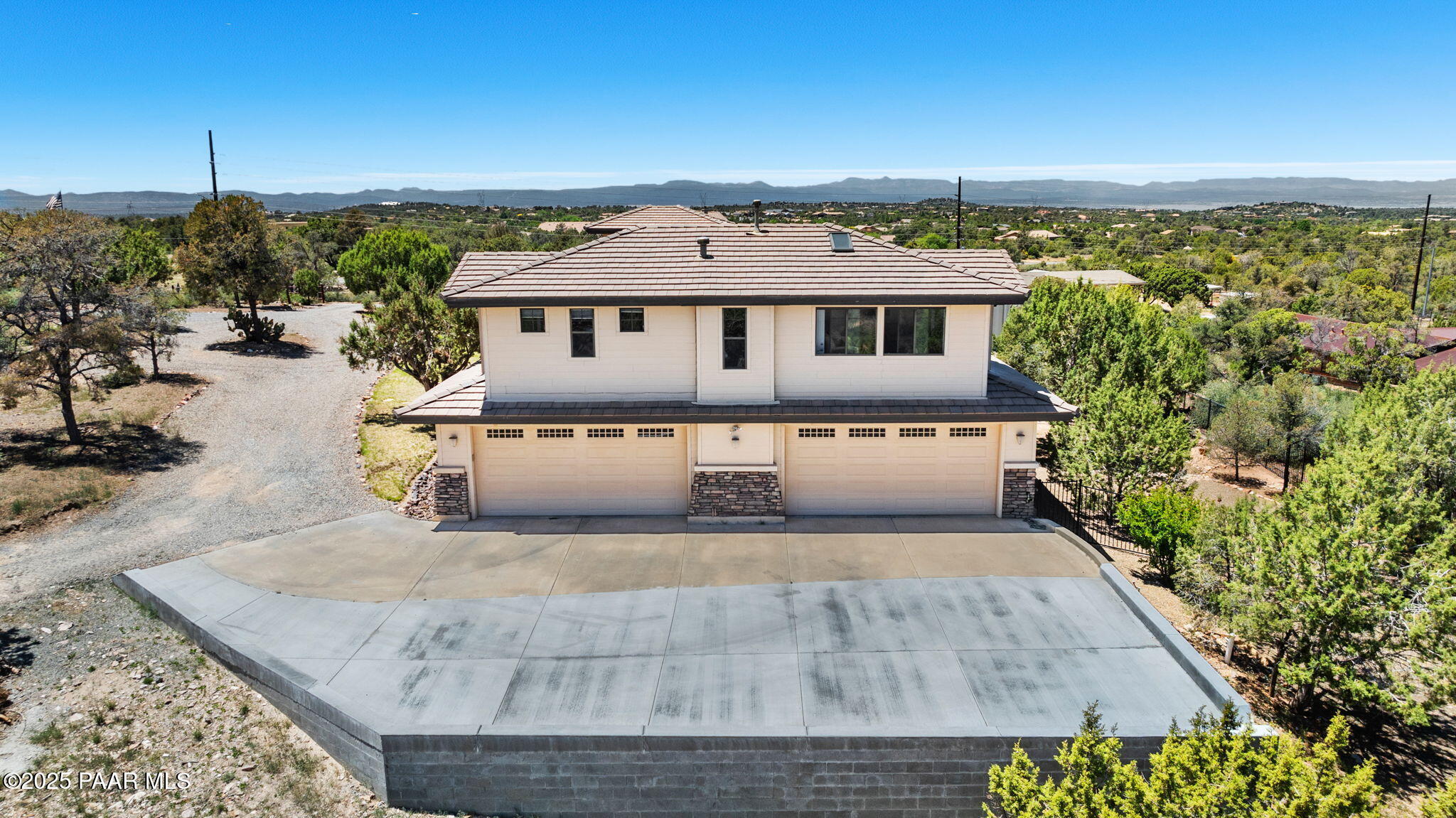 13175 North Bull Run Road Prescott, AZ 86305 - Photo 45 of 60 a view of a white house with a big yard and large tree