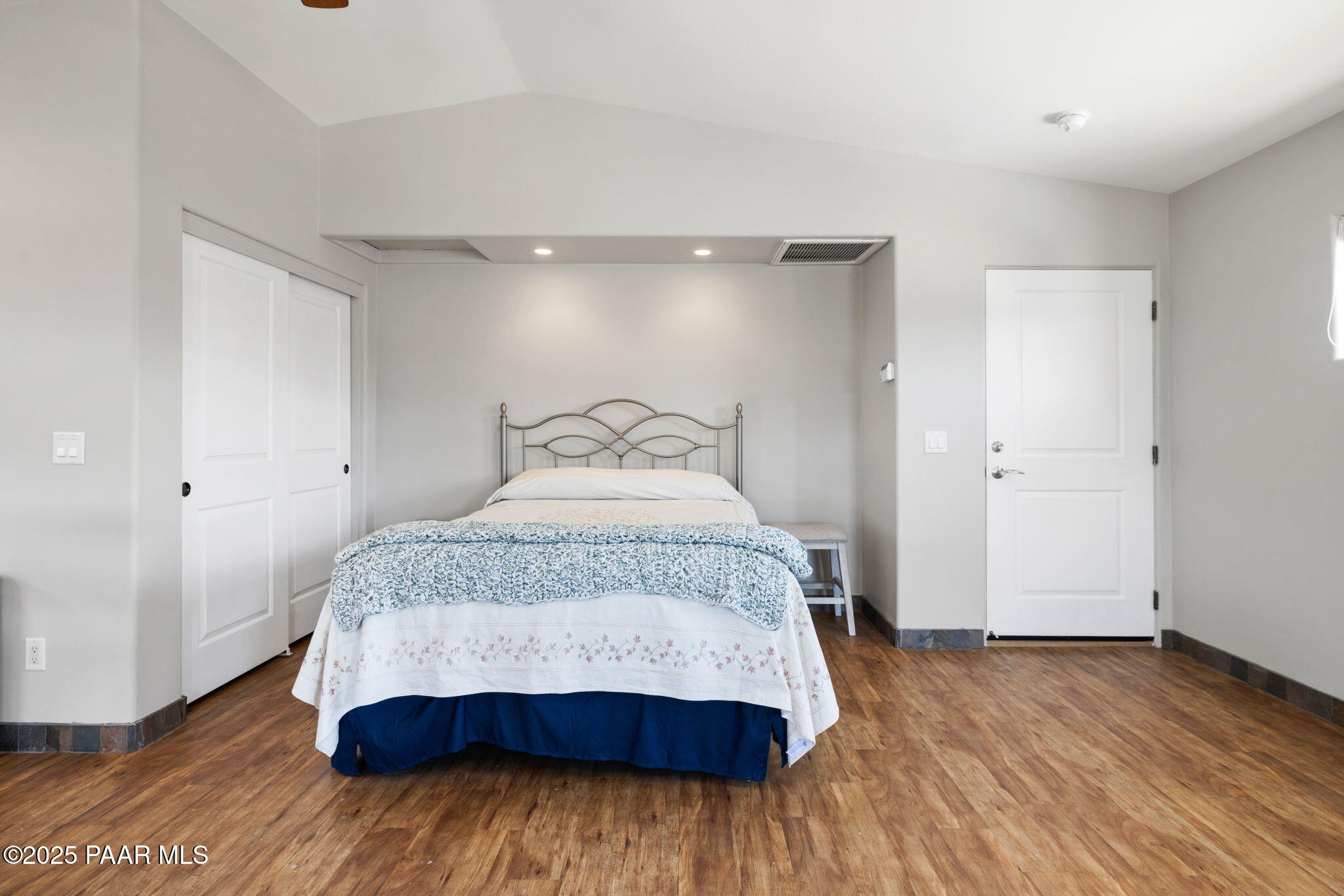 13175 North Bull Run Road Prescott, AZ 86305 - Photo 51 of 60 a bedroom with a bed and wooden floor