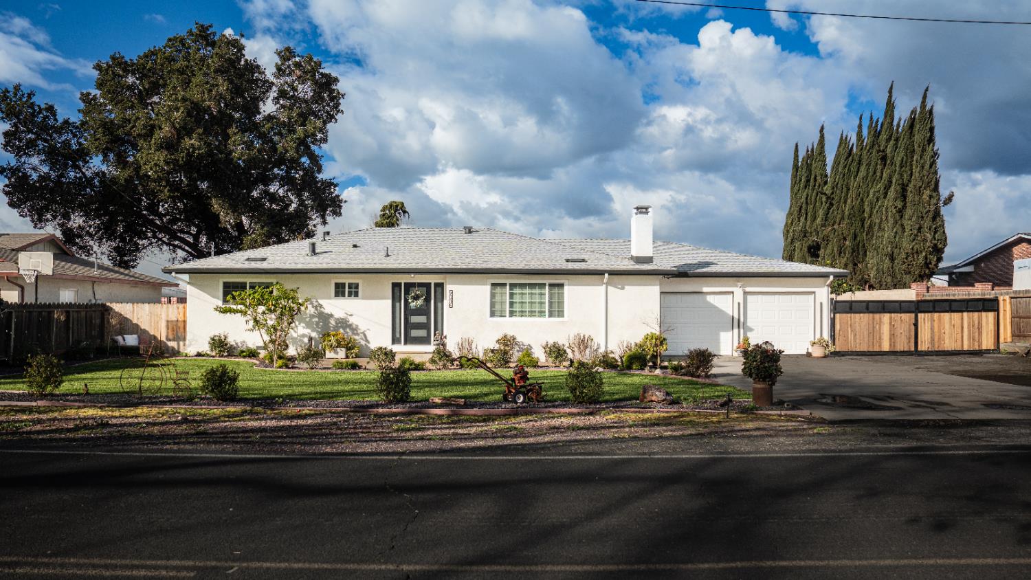 9115 East Southland Road Manteca, CA 95336 - Photo 1 of 52 a front view of house with car parked