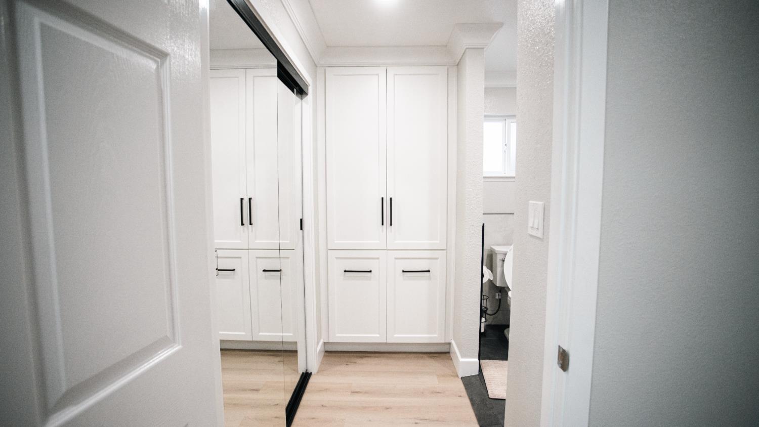 9115 East Southland Road Manteca, CA 95336 - Photo 15 of 52 a view of a hallway with white doors