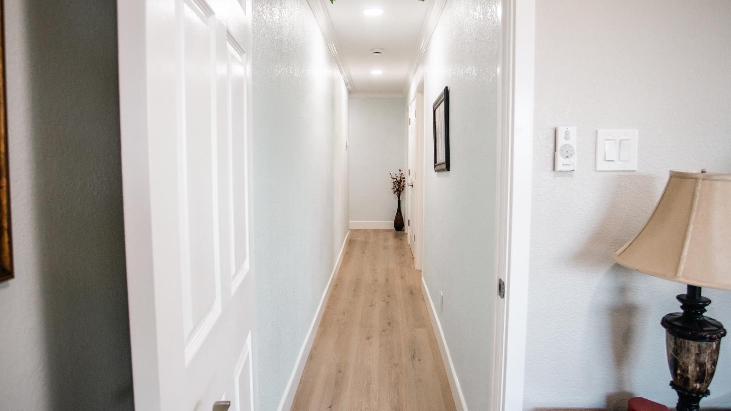 9115 East Southland Road Manteca, CA 95336 - Photo 22 of 52 a view of a bathroom from a hallway