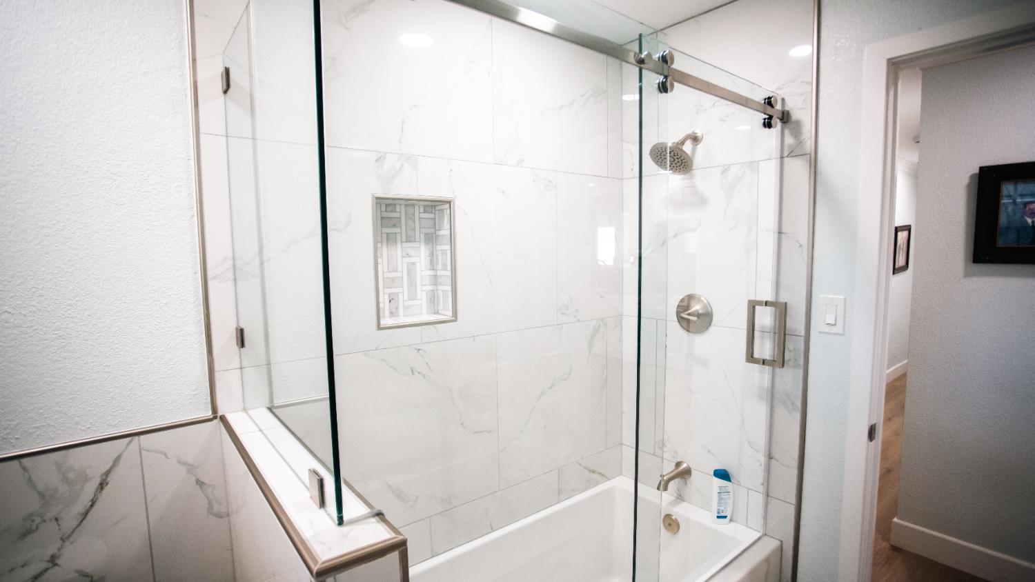 9115 East Southland Road Manteca, CA 95336 - Photo 26 of 52 a bathroom with a shower and a tub